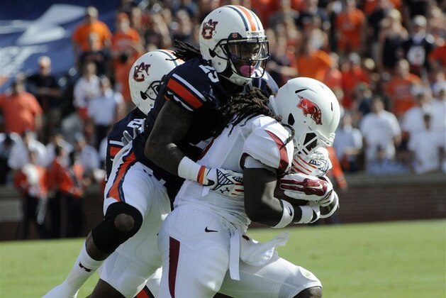 Auburn Tigers defensive back Nick Ruffin (19) tries to pick off a pass intended for Kansas State Wildcats wide receiver Tyler Lockett (16) as Auburn Tigers defensive back Trovon Reed (25) watches during an NCAA college football game Thursday, Sept. 18, 2014 in Manhattan, Kan. (AP Photo/Reed Hoffmann)