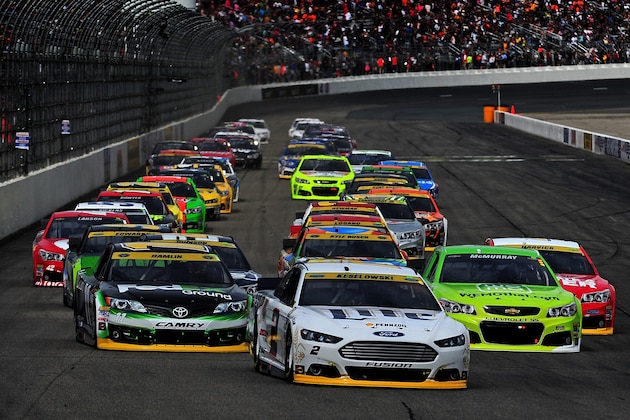LOUDON, NH - SEPTEMBER 21:  Brad Keselowski, driver of the #2 Miller Lite Ford, leads the field during the NASCAR Sprint Cup Series Sylvania 300 at New Hampshire Motor Speedway on September 21, 2014 in Loudon, New Hampshire.  (Photo by Will Schneekloth/Getty Images)