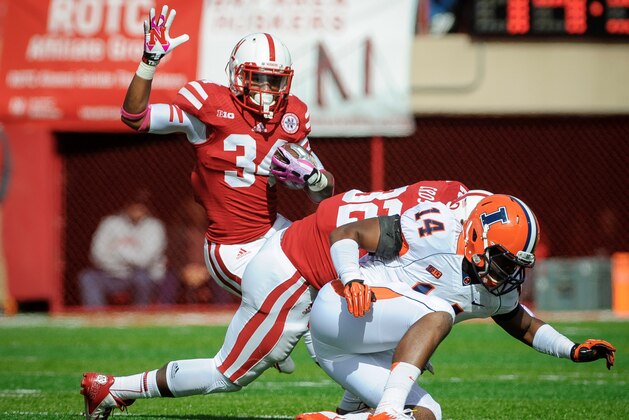 LINCOLN, NE - OCTOBER 5: Running back Terrell Newby #34 of the Nebraska Cornhuskers jumps over safety Eric Finney #14 of the Illinois Fighting Illini during their game at Memorial Stadium on October 5, 2013 in Lincoln, Nebraska. (Photo by Eric Francis/Getty Images)