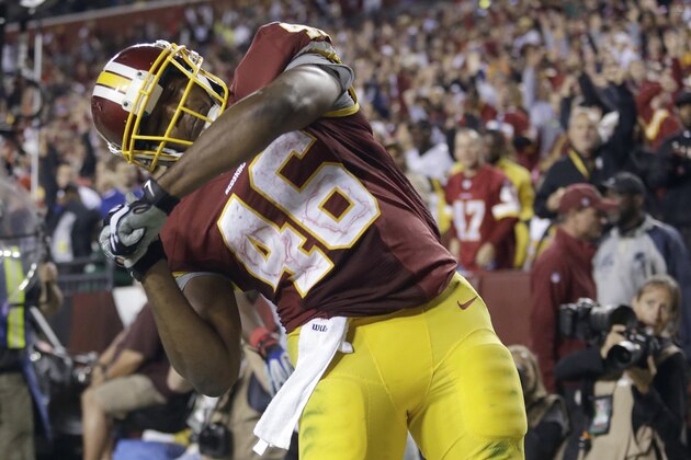 Washington Redskins running back Alfred Morris celebrates his touchdown during the second half of an NFL football game against the New York Giants in Landover, Md., Thursday, Sept. 25, 2014. (AP Photo/Patrick Semansky)