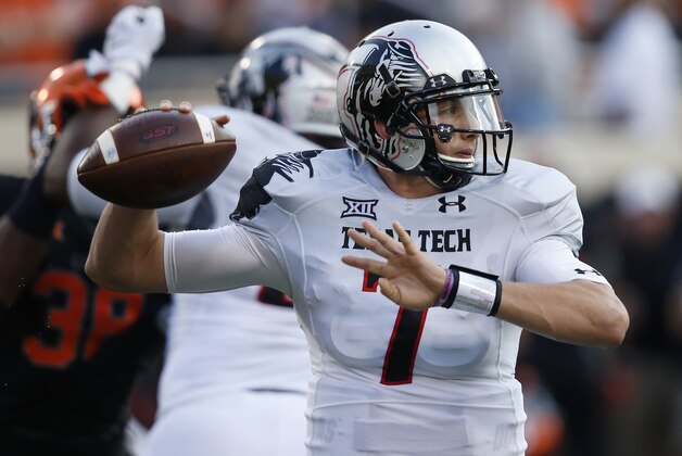 Texas Tech quarterback Davis Webb (7) passes in the first quarter of an NCAA college football game against Oklahoma State in Stillwater, Okla., Thursday, Sept. 25, 2014. (AP Photo/Sue Ogrocki)