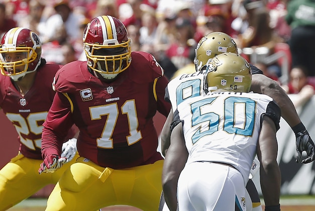 Sep 14, 2014; Landover, MD, USA; Washington Redskins tackle Trent Williams (71) blocks Jacksonville Jaguars defensive end Chris Clemons (91) at FedEx Field. Mandatory Credit: Geoff Burke-USA TODAY Sports