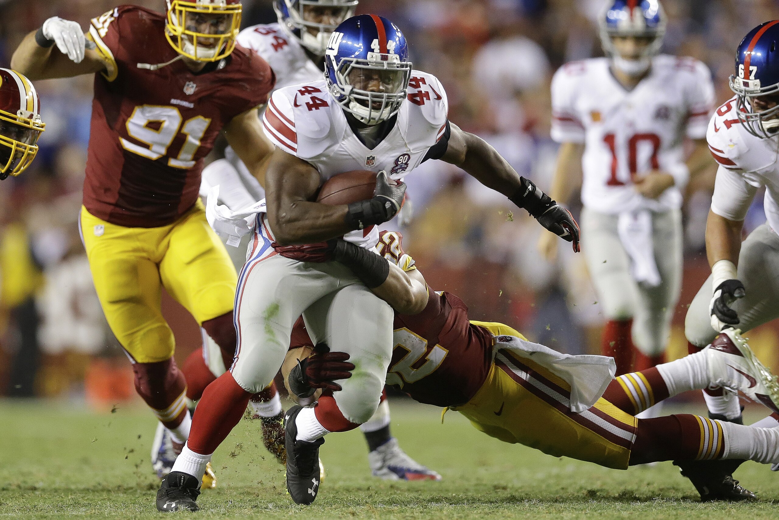 New York Giants running back Andre Williams (44) carries the ball during the second half of an NFL Thursday night football game against the Washington Redskins in Landover, Md., Thursday, Sept. 25, 2014. (AP Photo/Patrick Semansky)