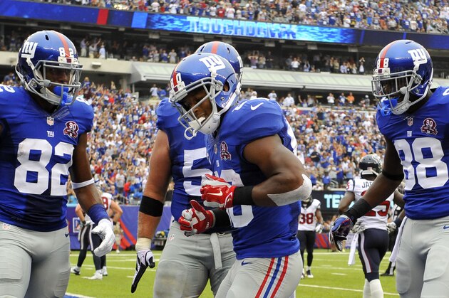 EAST RUTHERFORD, NJ - SEPTEMBER 21:  Victor Cruz #80 of the New York Giants celebrates his touchdown with a dance against the Houston Texans in the second quarter at MetLife Stadium on September 21, 2014 in East Rutherford, New Jersey.  (Photo by Alex Goodlett/Getty Images)