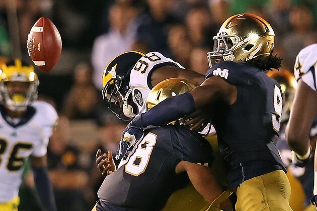 SOUTH BEND, IN - SEPTEMBER 06: Devin Gardner #98 of the Michigan Wolverines fumbles the ball as he is hit by Joe Schmidt #38 (L) abd Jaylon Smith #9 of the Notre Dame Fighting Irish at Notre Dame Stadium on September 6, 2014 in South Bend, Indiana. (Photo by Jonathan Daniel/Getty Images) SOUTH BEND, IN - SEPTEMBER 06: Devin Gardner #98 of the Michigan Wolverines fumbles the ball as he is hit by Joe Schmidt #38 (L) abd Jaylon Smith #9 of the Notre Dame Fighting Irish at Notre Dame Stadium on September 6, 2014 in South Bend, Indiana. (Photo by Jonathan Daniel/Getty Images)