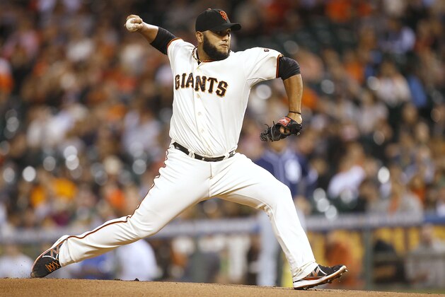 San Francisco Giants pitcher Yusmeiro Petit throws against the San Diego Padres during the first inning of a baseball game in San Francisco, Thursday, Sept. 25, 2014. (AP Photo/Tony Avelar)