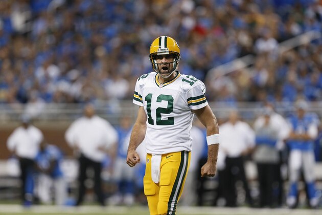 Green Bay Packers quarterback Aaron Rodgers yells at teammates during the first half of an NFL football game against the Detroit Lions in Detroit, Sunday, Sept. 21, 2014. (AP Photo/Paul Sancya)