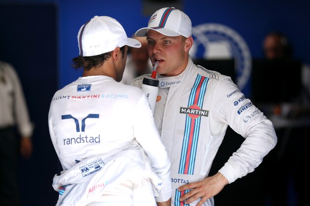 HOCKENHEIM, GERMANY - JULY 19:  Felipe Massa of Brazil and Williams speaks with Valtteri Bottas of Finland and Williams after they claimed third and second place on the grid respectively during qualifying ahead of the German Grand Prix at Hockenheimring on July 19, 2014 in Hockenheim, Germany.  (Photo by Mark Thompson/Getty Images)