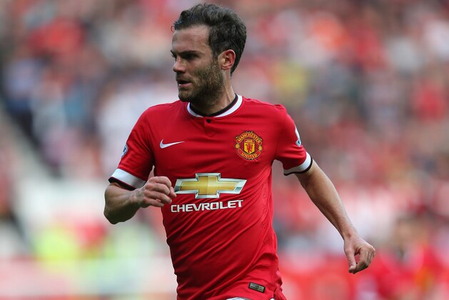MANCHESTER, ENGLAND - SEPTEMBER 14:  Juan Mata of Manchester United in action during the Barclays Premier League match between Manchester United and Queens Park Rangers at Old Trafford on September 14, 2014 in Manchester, England.  (Photo by Alex Livesey/Getty Images)