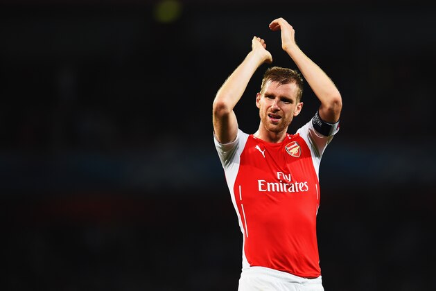 LONDON, ENGLAND - AUGUST 27:  Per Mertesacker of Arsenal celebrates at the end of the UEFA Champions League Qualifier 2nd leg match between Arsenal and Besiktas at the Emirates Stadium on August 27, 2014 in London, United Kingdom.  (Photo by Shaun Botterill/Getty Images)