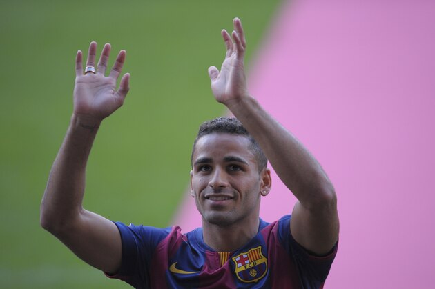 FC Barcelona's new Brazilian player Douglas Pereira gestures during his official presentation at the Camp Nou stadium in Barcelona, Spain, Friday, Aug. 29, 2014. Barcelona says it has agreed to sign defender Douglas Pereira from Sao Paulo on a five-season deal for 4 million euros ($5.3 million). (AP Photo/Manu Fernandez)
