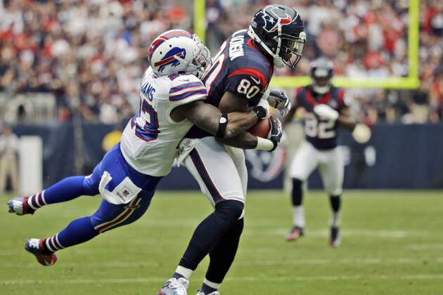 Buffalo Bills' Aaron Williams (23) tackles Houston Texans wide receiver Andre Johnson (80) in the third quarter of an NFL football game on Sunday, Nov. 4, 2012, in Houston. Williams was injured on the play and left the game. (AP Photo/David J. Phillip)
