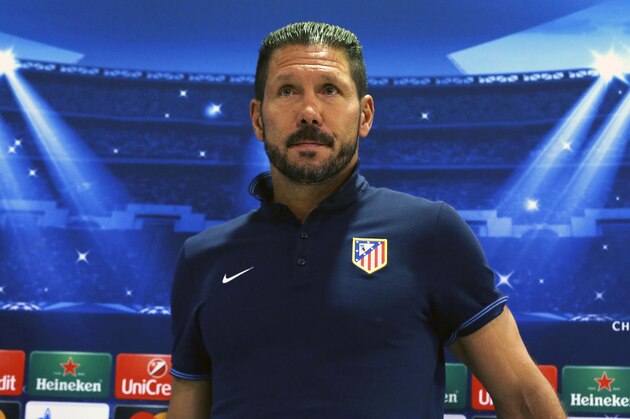 Atletico Madrid's coach Diego Simeone attends a press conference at the Georgios Karaiskakis stadium in the Piraeus port, near Athens on Monday, Sept. 15, 2014. Atletico Madrid will play against Olympiacos for the Group A Champions League soccer match on Tuesday. (AP Photo/Thanassis Stavrakis)