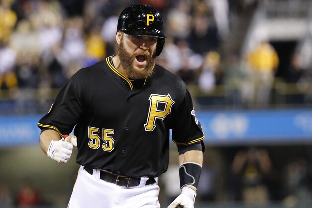Pittsburgh Pirates' Russell Martin rounds third base after hitting a three-run home run off Milwaukee Brewers relief pitcher Jonathan Broxton during the eighth inning of a baseball game in Pittsburgh Friday, Sept. 19, 2014. The Pirates won 4-2. (AP Photo/Gene Puskar)