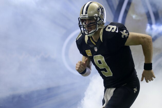 Dallas Cowboys quarterback Tony Romo (9) runs on the field during pre-game festivities of an NFL football game against the Dallas Cowboys in New Orleans, Sunday, Nov. 10, 2013. (AP Photo/Bill Haber)
