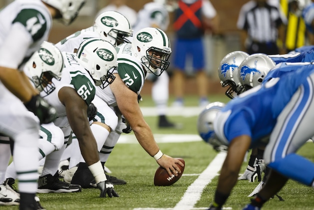 New York Jets guard Caleb Schlauderaff (72) gets set against the Detroit Lions during an NFL football game in Detroit, Friday, Aug. 9, 2013. (AP Photo/Rick Osentoski)