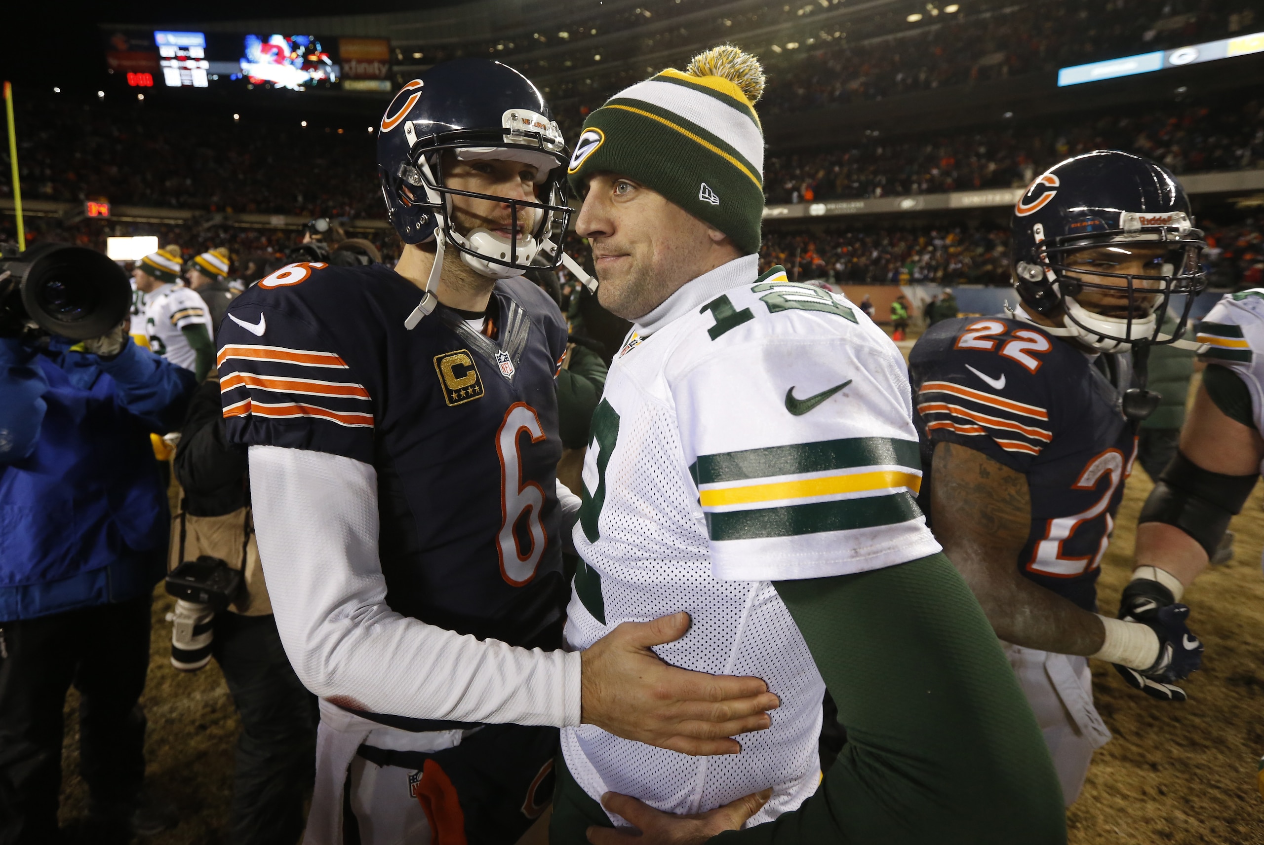 Green Bay Packers quarterback Aaron Rodgers (12) talks to Chicago Bears quarterback Jay Cutler (6) after an NFL football game, Sunday, Dec. 29, 2013, in Chicago. The Packers won 33-28. (AP Photo/Charles Rex Arbogast)