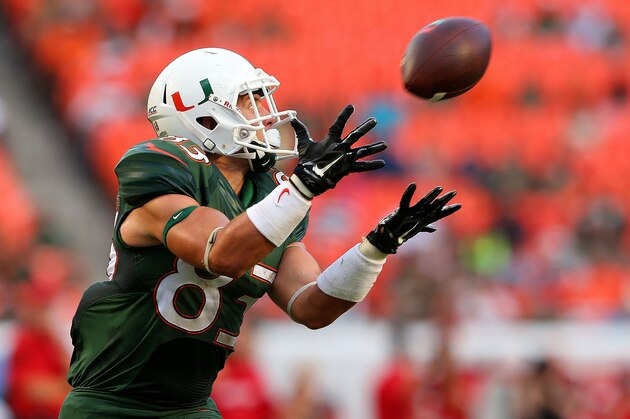 MIAMI, FL - SEPTEMBER 13:  Braxton Berrios #83 of the Miami Hurricanes makes a catch during a game against the Arkansas State Red Wolves at Sunlife Stadium on September 13, 2014 in Miami, Florida.  (Photo by Mike Ehrmann/Getty Images)