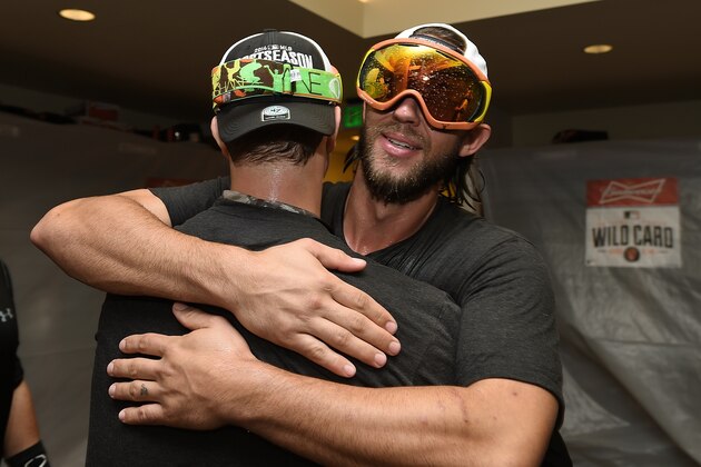 SAN FRANCISCO, CA - SEPTEMBER 25:  Madison Bumgarner #40 and Matt Cain #18 of the San Francisco Giants celebrates their wild card playoff birth after they defeated the San Diego Padres 9-8 at AT&T Park on September 25, 2014 in San Francisco, California.  (Photo by Thearon W. Henderson/Getty Images)