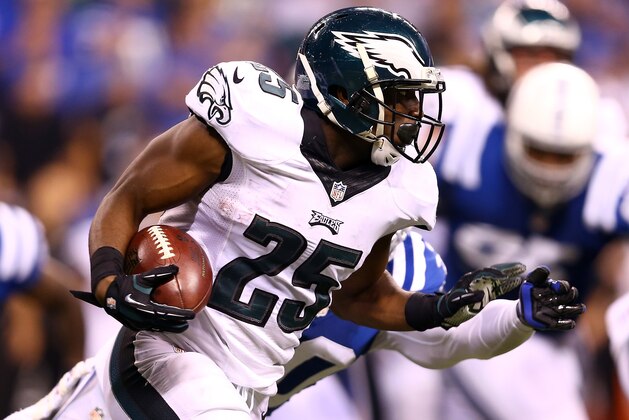 INDIANAPOLIS, IN - SEPTEMBER 15:  Running back LeSean McCoy #25 of the Philadelphia Eagles carries the ball as free safety LaRon Landry #30 of the Indianapolis Colts defends during a game at Lucas Oil Stadium on September 15, 2014 in Indianapolis, Indiana.  (Photo by Andy Lyons/Getty Images)