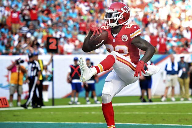 Sep 21, 2014; Miami Gardens, FL, USA; Kansas City Chiefs running back Joe McKnight (22) scores a touchdown against the Miami Dolphins in the game at Sun Life Stadium. The Chiefs defeated the Dolphins 34-15.  Mandatory Credit: Brad Barr-USA TODAY Sports