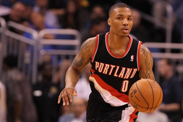 February 10, 2013; Orlando FL, USA; Portland Trail Blazers point guard Damian Lillard (0) drives to the basket against the Orlando Magic during the second quarter at Amway Center. Mandatory Credit: Kim Klement-USA TODAY Sports