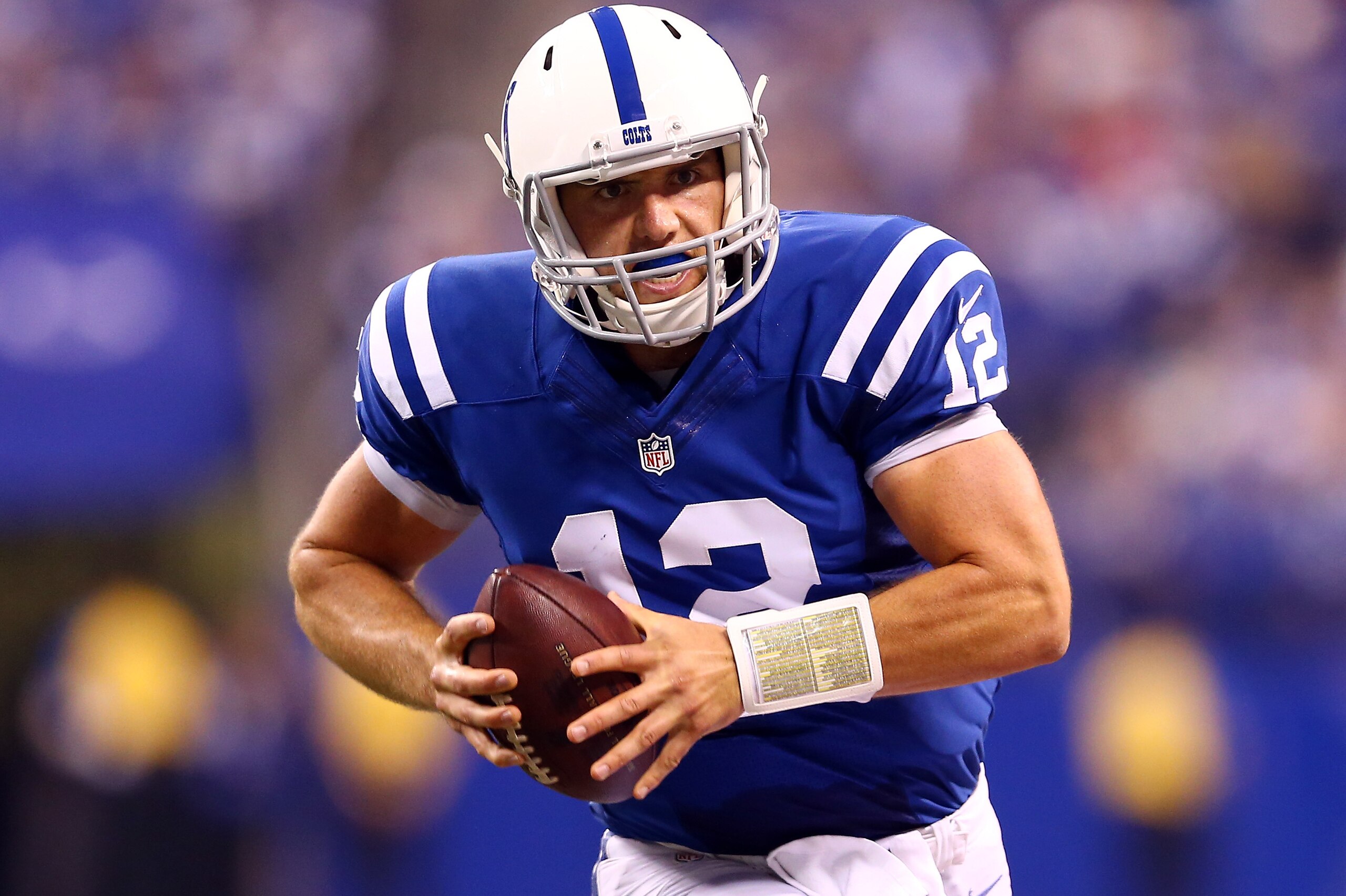 INDIANAPOLIS, IN - SEPTEMBER 15:  Quarterback Andrew Luck #12 of the Indianapolis Colts runs with the ball against the Philadelphia Eagles during a game at Lucas Oil Stadium on September 15, 2014 in Indianapolis, Indiana.  (Photo by Andy Lyons/Getty Images)