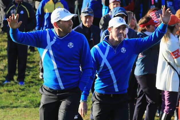 AUCHTERARDER, SCOTLAND - SEPTEMBER 26:  Sergio Garcia (L) and Rory McIlroy of Europe wave to the crowd as they walk towards the 1st tee during the Morning Fourballs of the 2014 Ryder Cup on the PGA Centenary course at the Gleneagles Hotel on September 26, 2014 in Auchterarder, Scotland.  (Photo by David Cannon/Getty Images)