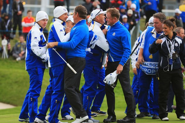 AUCHTERARDER, SCOTLAND - SEPTEMBER 26:  Lee Westwood of Europe celebrates victory with team mate Ian Poulter on the 18th green during the Afternoon Foursomes of the 2014 Ryder Cup on the PGA Centenary course at the Gleneagles Hotel on September 26, 2014 in Auchterarder, Scotland.  (Photo by David Cannon/Getty Images)