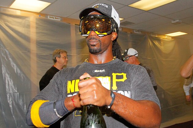 ATLANTA, GA - SEPTEMBER 23:  Andrew McCutchen #22 of the Pittsburgh Pirates celebrates clinching a National League playoff spot after their 3-2 win over the Atlanta Braves at Turner Field on September 23, 2014 in Atlanta, Georgia.  (Photo by Kevin C. Cox/Getty Images)