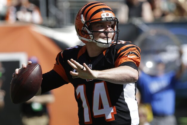 Cincinnati Bengals quarterback Andy Dalton passes against the Tennessee Titans in the first half of an NFL football game, Sunday, Sept. 21, 2014, in Cincinnati. (AP Photo/Al Behrman)