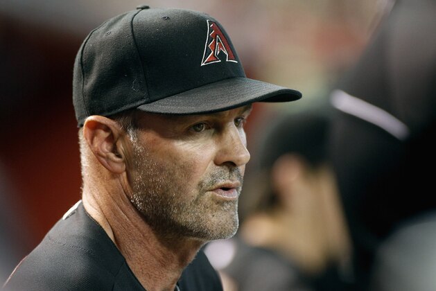 PHOENIX, AZ - SEPTEMBER 13:  Manager Kirk Gibson #23 of the Arizona Diamondbacks looks on from the dugout during the second inning of a MLB game against the San Diego Padres at Chase Field on September 13, 2014 in Phoenix, Arizona.  (Photo by Ralph Freso/Getty Images)