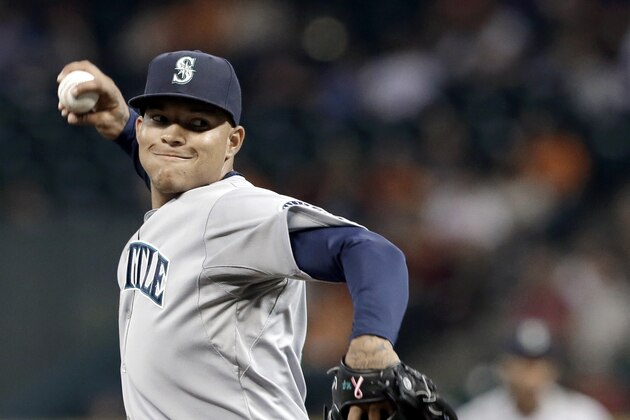 Seattle Mariners' Taijuan Walker delivers a pitch against the Houston Astros in the first inning of a baseball game Friday, Sept. 19, 2014, in Houston. (AP Photo/Pat Sullivan)