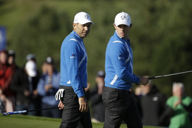 Europe’s Sergio Garcia and Rory McIlroy, right, prepare to putt on the 15th green during the foursomes match on the first day of the Ryder Cup golf tournament at Gleneagles, Scotland, Friday, Sept. 26, 2014. (AP Photo/Matt Dunham)