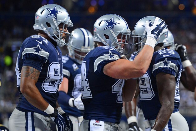 Sep 21, 2014; St. Louis, MO, USA; Dallas Cowboys running back DeMarco Murray (29) is congratulated by teammates after scoring a touchdown against the St. Louis Rams during the first half at the Edward Jones Dome. Mandatory Credit: Jasen Vinlove-USA TODAY Sports