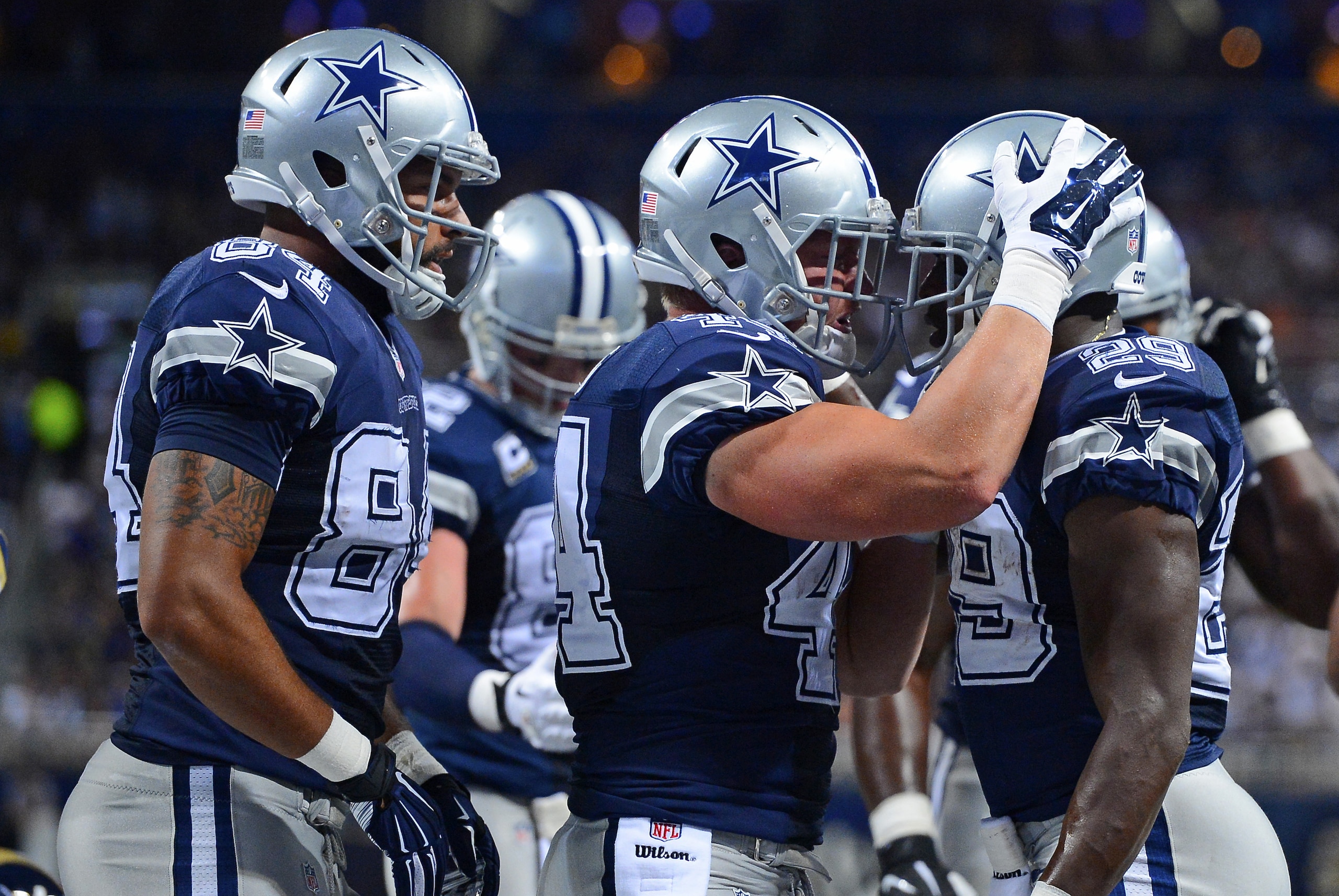 Sep 21, 2014; St. Louis, MO, USA; Dallas Cowboys running back DeMarco Murray (29) is congratulated by teammates after scoring a touchdown against the St. Louis Rams during the first half at the Edward Jones Dome. Mandatory Credit: Jasen Vinlove-USA TODAY Sports
