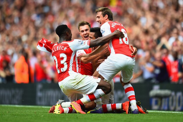 LONDON, ENGLAND - SEPTEMBER 13:  Alexis Sanchez of Arsenal celebrates scoring their second goal with team mates during the Barclays Premier League match between Arsenal and Manchester City at Emirates Stadium on September 13, 2014 in London, England.  (Photo by Shaun Botterill/Getty Images)