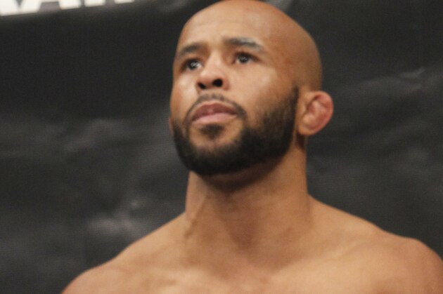 Defending Champion Demetrious Johnson warms up before fighting Joseph Benavidez  for the UFC Flyweight Mixed Martial Arts title in Sacramento, Calif., on Saturday, Dec. 14, 2013.(AP Photo/Steve Yeater)