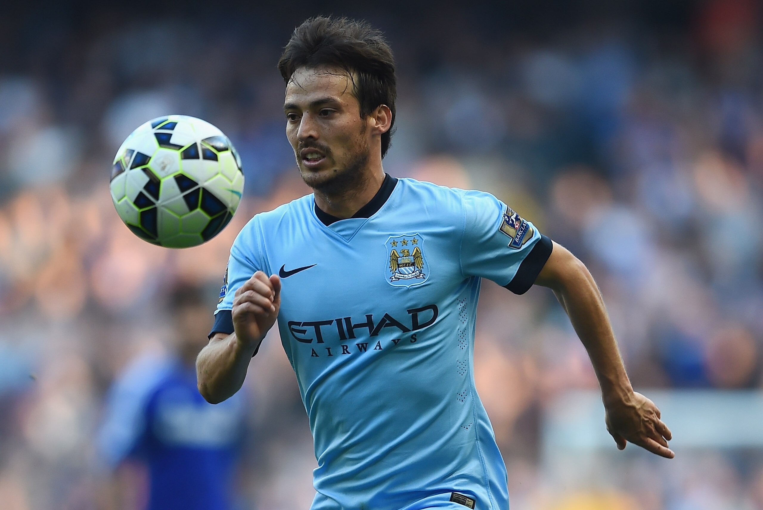 MANCHESTER, ENGLAND - SEPTEMBER 21:  David Silva of Manchester City in action during the Barclays Premier League match between Manchester City and Chelsea at Etihad Stadium on September 21, 2014 in Manchester, England.  (Photo by Laurence Griffiths/Getty Images)