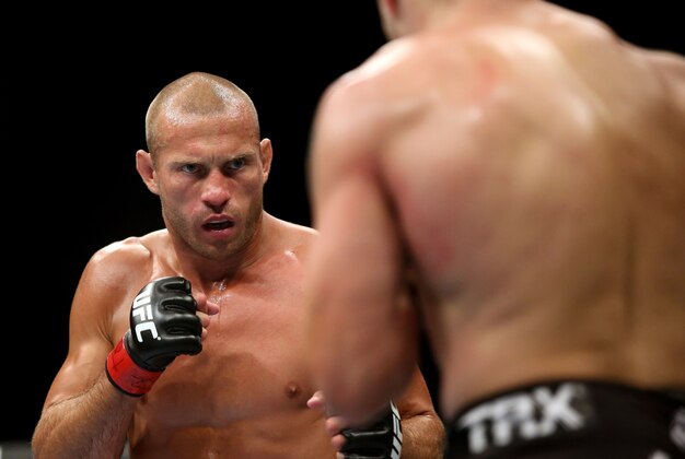 Jul 16, 2014; Atlantic City, NJ, USA; Donald Cerrone (red gloves) stares down Jim Miller (blue gloves) during a 5-round lightweight bout at Revel Casino. Mandatory Credit: Bill Streicher-USA TODAY Sports Jul 16, 2014; Atlantic City, NJ, USA; Donald Cerrone (red gloves) stares down Jim Miller (blue gloves) during a 5-round lightweight bout at Revel Casino. Mandatory Credit: Bill Streicher-USA TODAY Sports