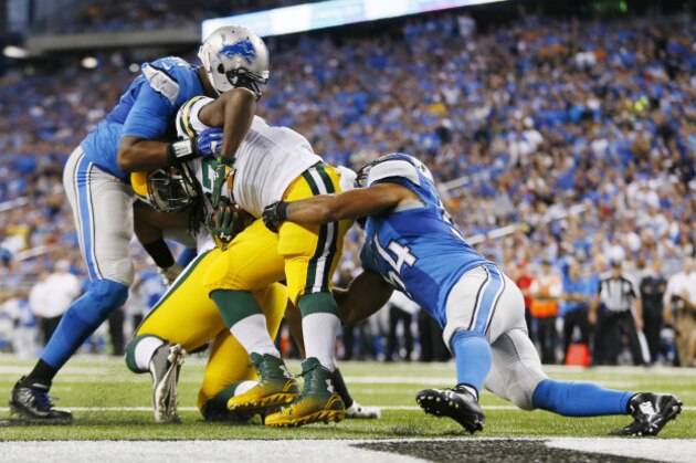 Green Bay Packers running back Eddie Lacy is tackled in the end zone by Detroit Lions outside linebacker DeAndre Levy (54) for a safety during the first half of an NFL football game in Detroit, Sunday, Sept. 21, 2014.