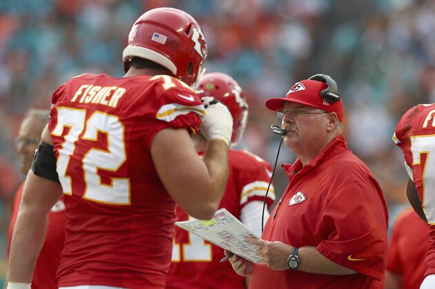 MIAMI GARDENS, FL - SEPTEMBER 21:  Head coach Andy Reid of the Kansas City Chiefs looks on from the sideline during action against the Miami Dolphins at Sun Life Stadium on September 21, 2014 in Miami Gardens, Florida. At left is offensive tackle Eric Fisher #72 and at right is offensive guard Zach Fulton #73.   (Photo by Ronald Martinez/Getty Images)