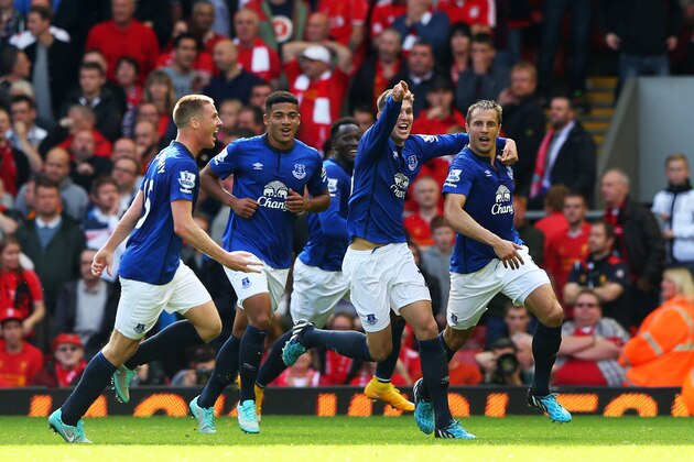 LIVERPOOL, ENGLAND - SEPTEMBER 27:  Phil Jagielka (R) of Everton celebrates with teammates after scoring a late goal to level the scores at 1-1 during the Barclays Premier League match between Liverpool and Everton at Anfield on September 27, 2014 in Liverpool, England.  (Photo by Alex Livesey/Getty Images)