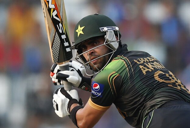 Pakistan's batsman Umar Akmal plays a shot during their ICC Twenty20 Cricket World Cup match against Australia in Dhaka, Bangladesh, Sunday, March 23, 2014. (AP Photo/Aijaz Rahi)
