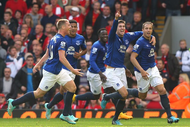 LIVERPOOL, ENGLAND - SEPTEMBER 27:  Phil Jagielka of Everton celebrates with team mates after scoring the equalising goal during the Barclays Premier League match between Liverpool and Everton at Anfield on September 27, 2014 in Liverpool, England.  (Photo by Alex Livesey/Getty Images)