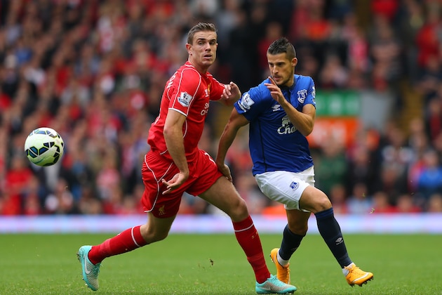 LIVERPOOL, ENGLAND - SEPTEMBER 27:  Kevin Mirallas of Everton goes past Jordan Henderson of Liverpool during the Barclays Premier League match between Liverpool and Everton at Anfield on September 27, 2014 in Liverpool, England.  (Photo by Alex Livesey/Getty Images)