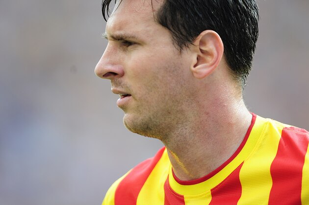 FC Barcelona's Lionel Messi looks on during a Spanish La Liga soccer match against Athletic Bilbao at the Camp Nou stadium in Barcelona, Spain, Saturday, Sept. 13, 2014. (AP Photo/Manu Fernandez)