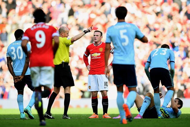 MANCHESTER, ENGLAND - SEPTEMBER 27:  Wayne Rooney of Manchester United receives a straight red card by referee Lee Mason after a foul on Stewart Downing of West Ham during the Barclays Premier League match between Manchester United and West Ham United at Old Trafford on September 27, 2014 in Manchester, England.  (Photo by Laurence Griffiths/Getty Images)