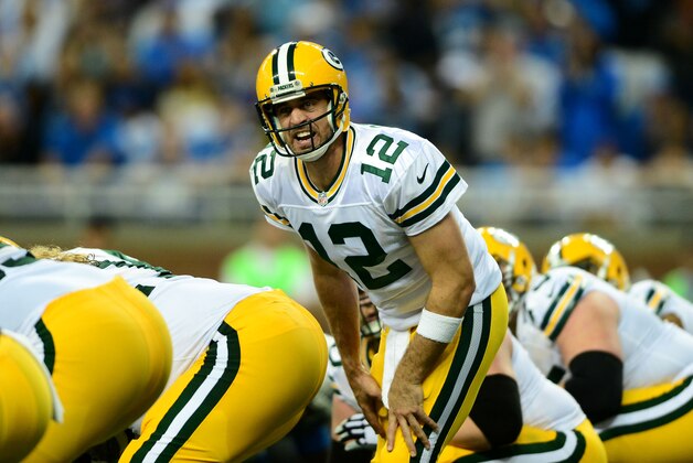 Sep 21, 2014; Detroit, MI, USA; Green Bay Packers quarterback Aaron Rodgers (12) gestures at the line of scrimmage during the second quarter against the Detroit Lions at Ford Field. Mandatory Credit: Andrew Weber-USA TODAY Sports