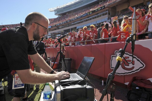 Zach Aaron of Reliant Media Systems monitors sound levels as the Kansas Chiefs fans try for a world record for loudest stadium during the first half of their NFL football game against the Oakland Raiders at Arrowhead Stadium in Kansas City, Mo., Sunday, Oct. 13, 2013. (AP Photo/Reed Hoffmann)